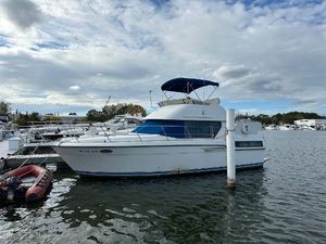 Carver 350 Aft Cabin Motor Yacht 1994 Carver 350 Aft Cabin Motor Yacht docked on a calm waterway.