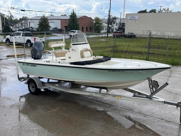 Key West 210 Bay Reef 2016 Key West 210 Bay Reef boat on trailer, parked outdoors.