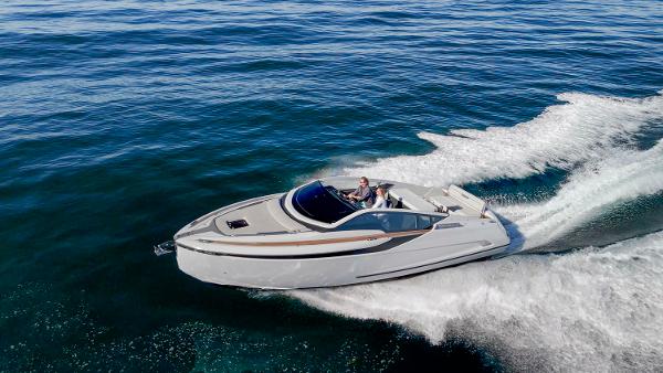 Fairline Fline 33 2021 Fairline Fline 33 cruising on open water, creating a dynamic wake.