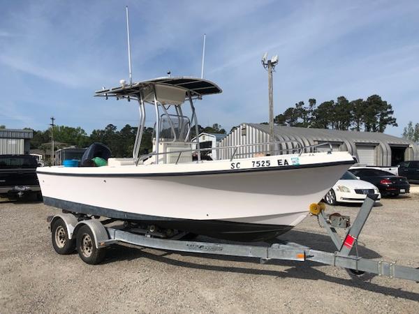 May-Craft 2000 Center Console 2005 May-Craft 2000 CC boat on trailer in outdoor storage area.