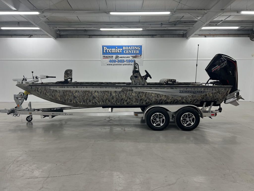Ranger RB210 2024 Ranger RB210 boat on trailer at Premier Boating Center showroom.