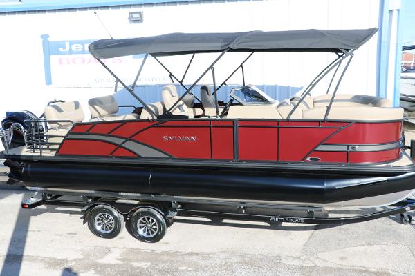 Sylvan L3 RLZ 2024 Sylvan L3 RLZ pontoon boat with red and black exterior on a trailer.