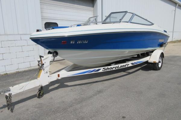 Rinker 186 Captiva 1993 Rinker 186 Captiva boat on ShoreLand'r trailer, blue and white.