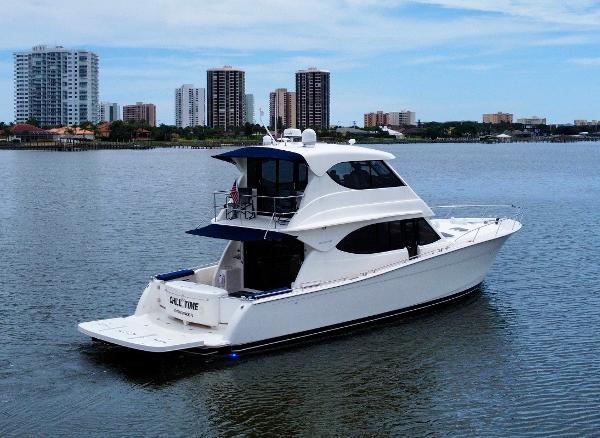 Maritimo Enclosed Fly Bridge 2007 Maritimo Enclosed Fly Bridge yacht on calm water with city skyline in background.