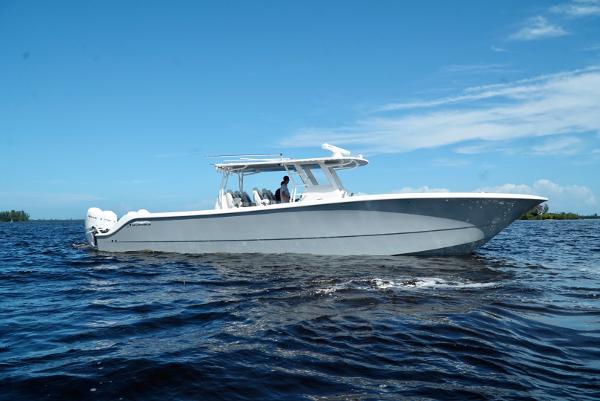 Invincible 46 Catamaran 2021 Invincible 46 Catamaran cruising on open water under a clear blue sky.
