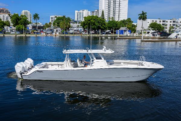 Invincible 46 Catamaran 2023 Invincible 46 Catamaran cruising on a calm urban waterway.