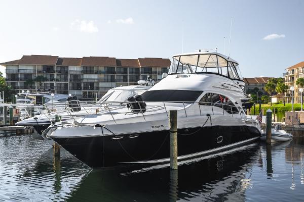 Sea Ray 58 Sedan Bridge 2008 Sea Ray 58 Sedan Bridge yacht docked at marina with waterfront buildings.
