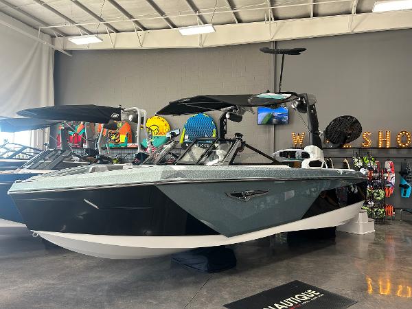 Nautique Super Air Nautique S23 2024 Nautique Super Air Nautique S23 boat displayed in showroom.