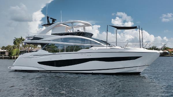 Pearl 62 Luxury Pearl 62 yacht, 2022 model, cruising on calm waters under a partly cloudy sky.