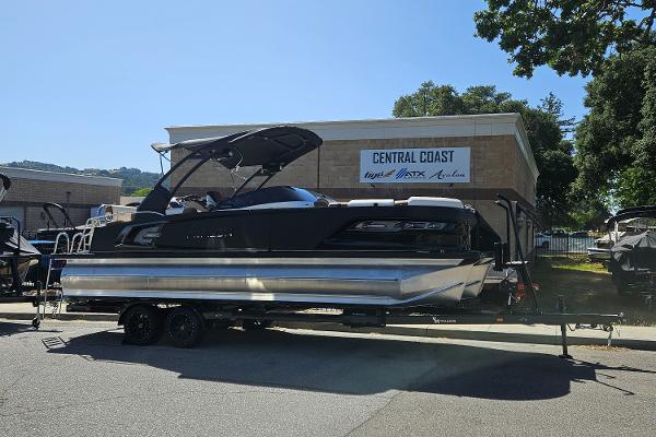 Avalon Excalibur LTD Quad Lounge Windshield 2024 Avalon Excalibur LTD Quad Lounge Windshield boat on trailer at Central Coast dealership.
