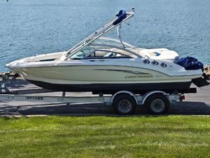 Chaparral 196 SSi 2011 Chaparral 196 SSi boat on trailer by a lake.
