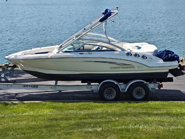 Chaparral 196 SSi 2011 Chaparral 196 SSi boat on trailer by a lake.
