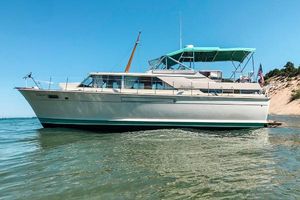 Chris-Craft 42' Commander 1967 Chris-Craft 42' Commander yacht on calm water, clear sky background.