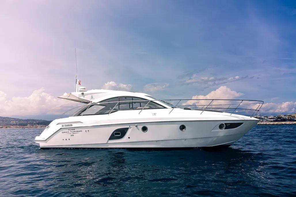Beneteau Gran Turismo 38 2012 Beneteau GRAN TURISMO 38 yacht cruising on open water under a clear sky.