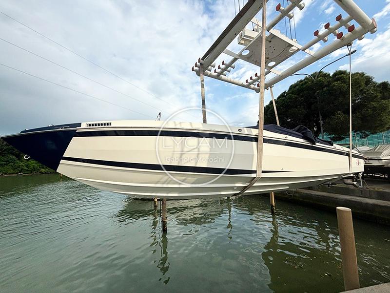 Cigarette 35 AWESOME 1974 Cigarette 35 AWESOME speedboat suspended over water, showcasing sleek design and classic style.