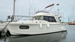 Beneteau Swift Trawler 30 2020 Beneteau Swift Trawler 30 docked in a marina, side view.