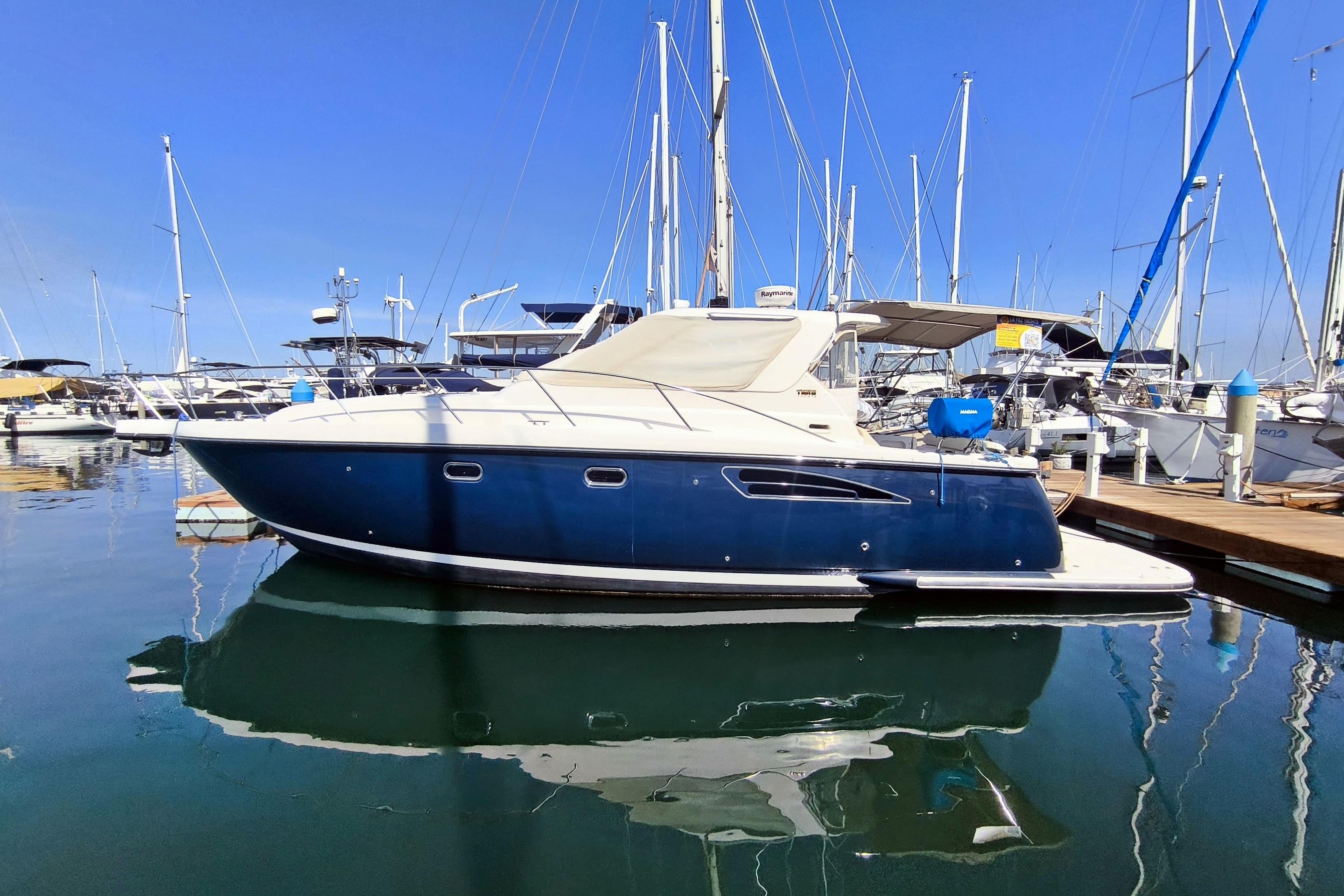 Tiara Yachts 3600 Sovran 2005 Tiara Yachts 3600 Sovran docked in a marina, reflecting on calm water.