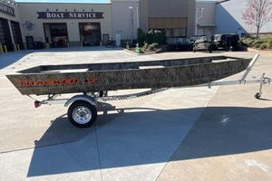 Tracker Grizzly 15 Jon 2026 Tracker Grizzly 15 Jon boat on trailer outside boat service center.