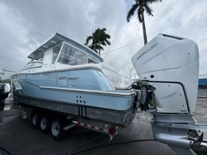 World Cat 400 DC-X 2024 World Cat 400 DC-X boat with Mercury outboard engine on a trailer.