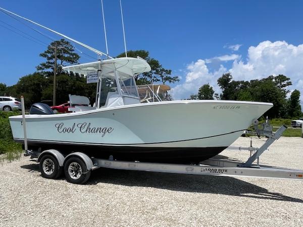 Regulator 23 Cc 2004 Regulator 23' CC boat named "Cool Change" on a trailer, parked outdoors.