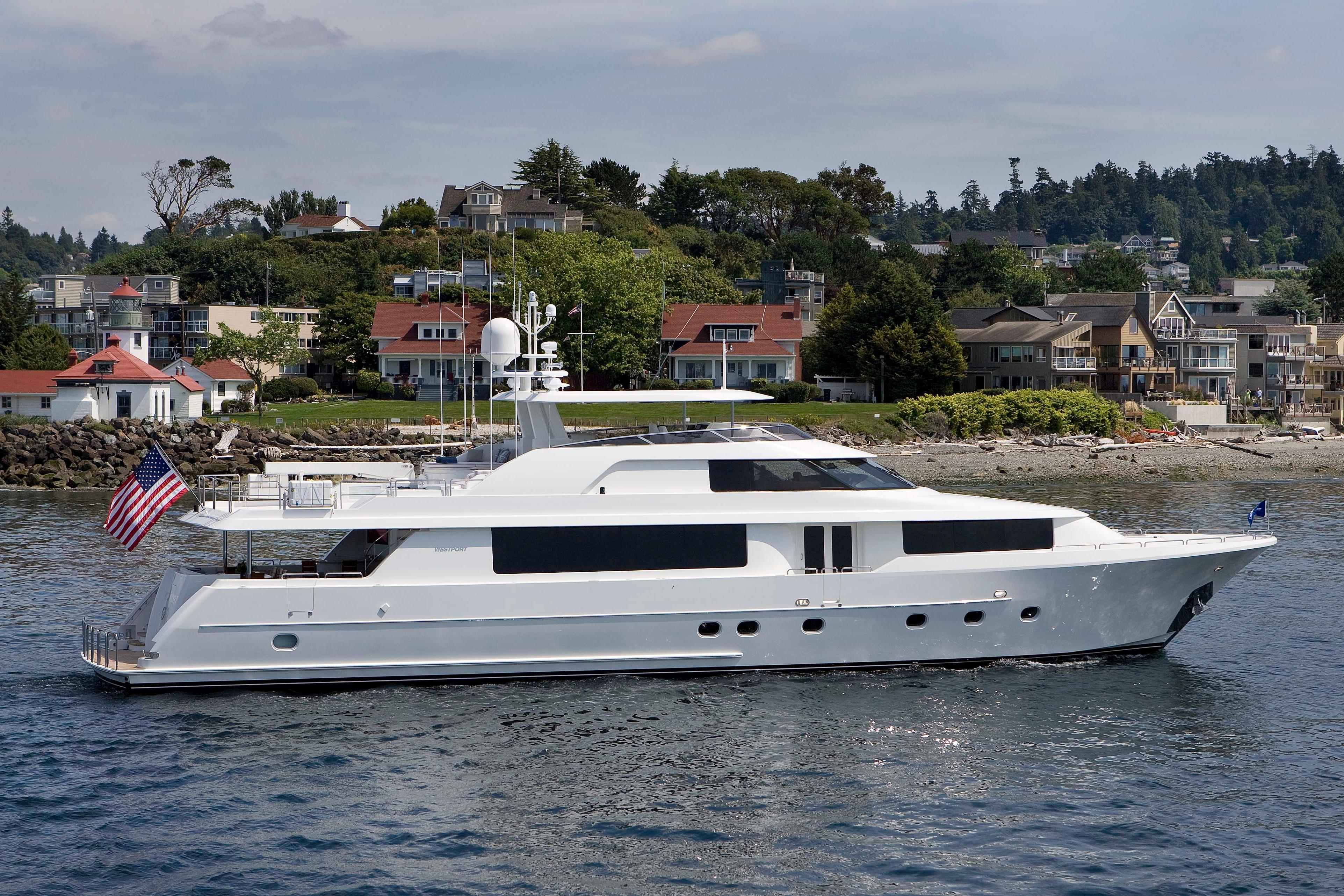 Westport Raised Pilothouse Motor Yacht 2011 Westport Raised Pilothouse Motor Yacht cruising near coastal homes.