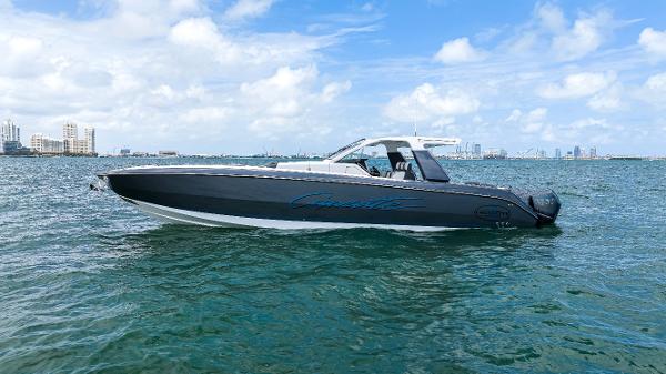 Cigarette 42 Auroris 2022 Cigarette 42 Auroris boat on open water under blue sky.