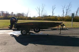 Tracker Grizzly 1756 T Marsh 2026 Tracker Grizzly 1756 T Marsh boat on trailer, parked on a sunny day.