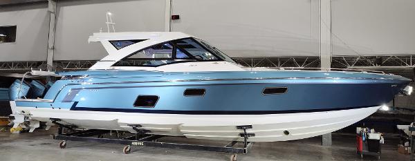 Formula 430 All Sport Crossover 2020 Formula 430 All Sport Crossover boat in a showroom, side view.