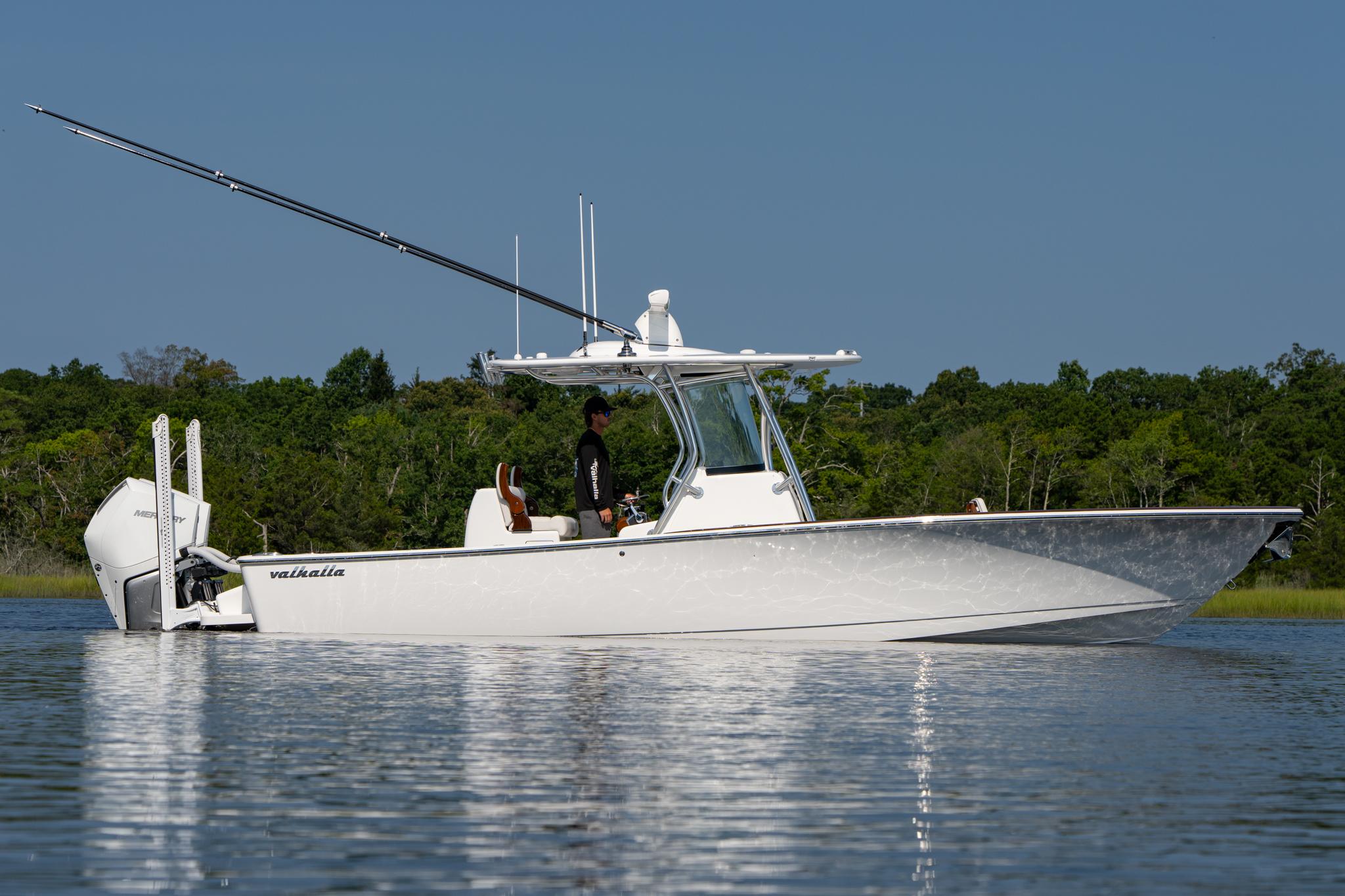 Valhalla Boatworks V-29 Hybrid 2025 Valhalla Boatworks V-29 Hybrid on calm water, surrounded by lush greenery.