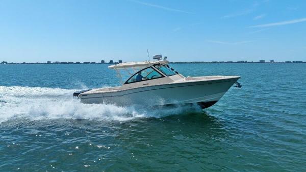 Grady-White Freedom 375 2016 Grady-White Freedom 375 cruising on open water under clear blue skies.
