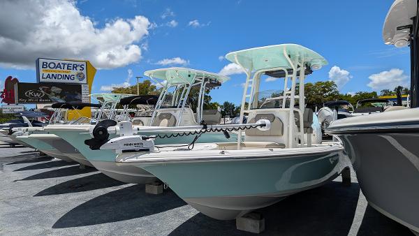 Key West 230 Bay Reef 2024 Key West 230 Bay Reef boats displayed at Boater's Landing under a clear blue sky.