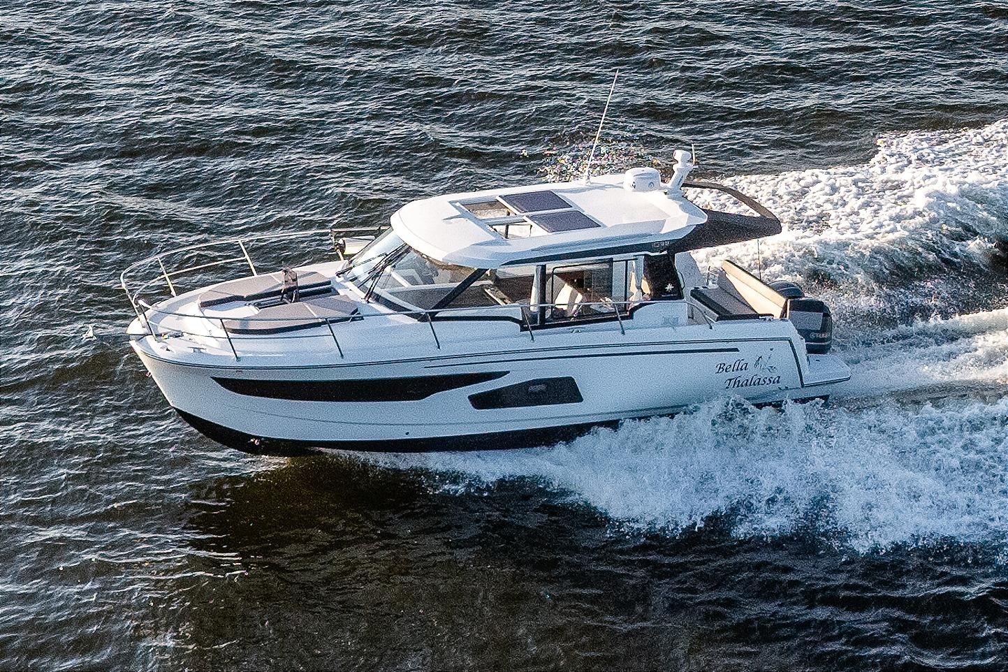Jeanneau NC 1095 2021 Jeanneau NC 1095 motor yacht cruising on open water.