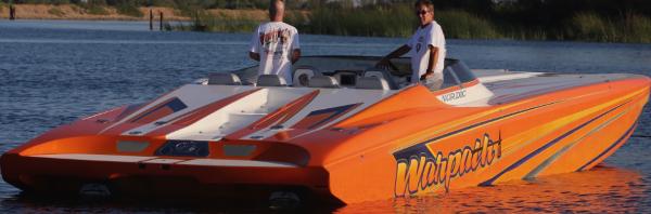Nordic Powerboats 43 Enforcer 2014 Nordic Powerboats 43 Enforcer in vibrant orange on calm water.
