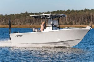 Parker 230 Coastal Elite Manufacturer Provided Image: 2026 Parker 230 Coastal Elite boat cruising on a serene lake.