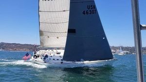 Beneteau First 47.7 Sailing yacht Beneteau First 47.7 (2001) with USA flag on open water.
