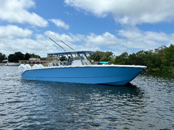 Invincible 40 Catamaran 2024 Invincible 40 Catamaran on calm water with blue sky background.