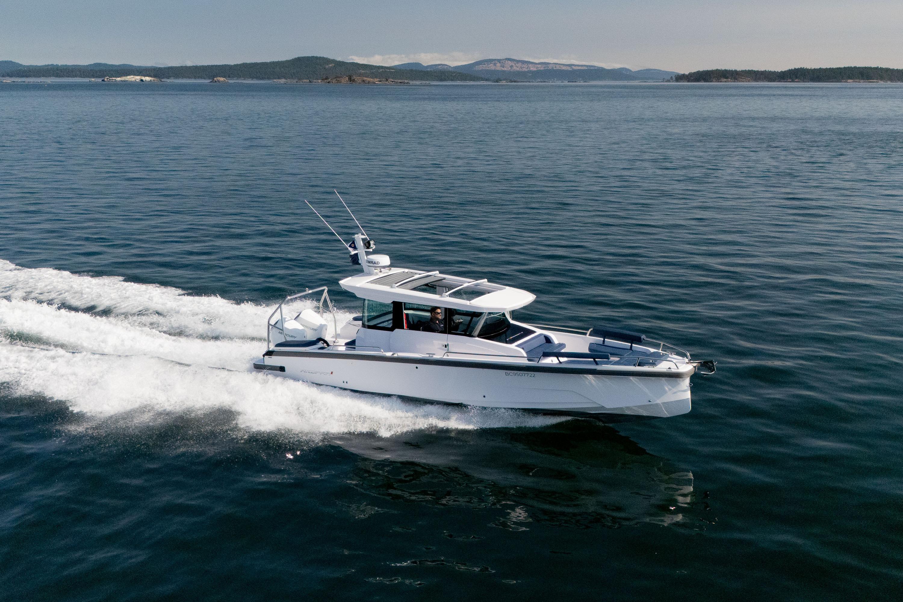 Axopar 29XC Cross Cabin - Aft Bench Seat 2025 Axopar 29XC Cross Cabin boat cruising on open water.