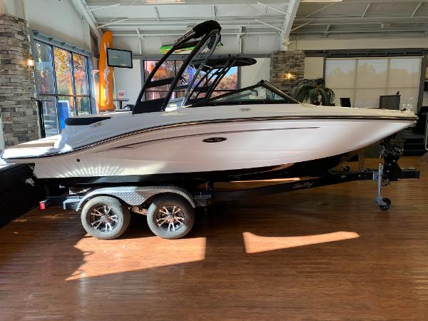 Sea Ray SPX 190 2023 Sea Ray SPX 190 boat on display in a showroom.