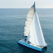 Fountaine Pajot Belize 43 Sailing catamaran Fountaine Pajot Belize 43, 2003 model, gliding on open sea.