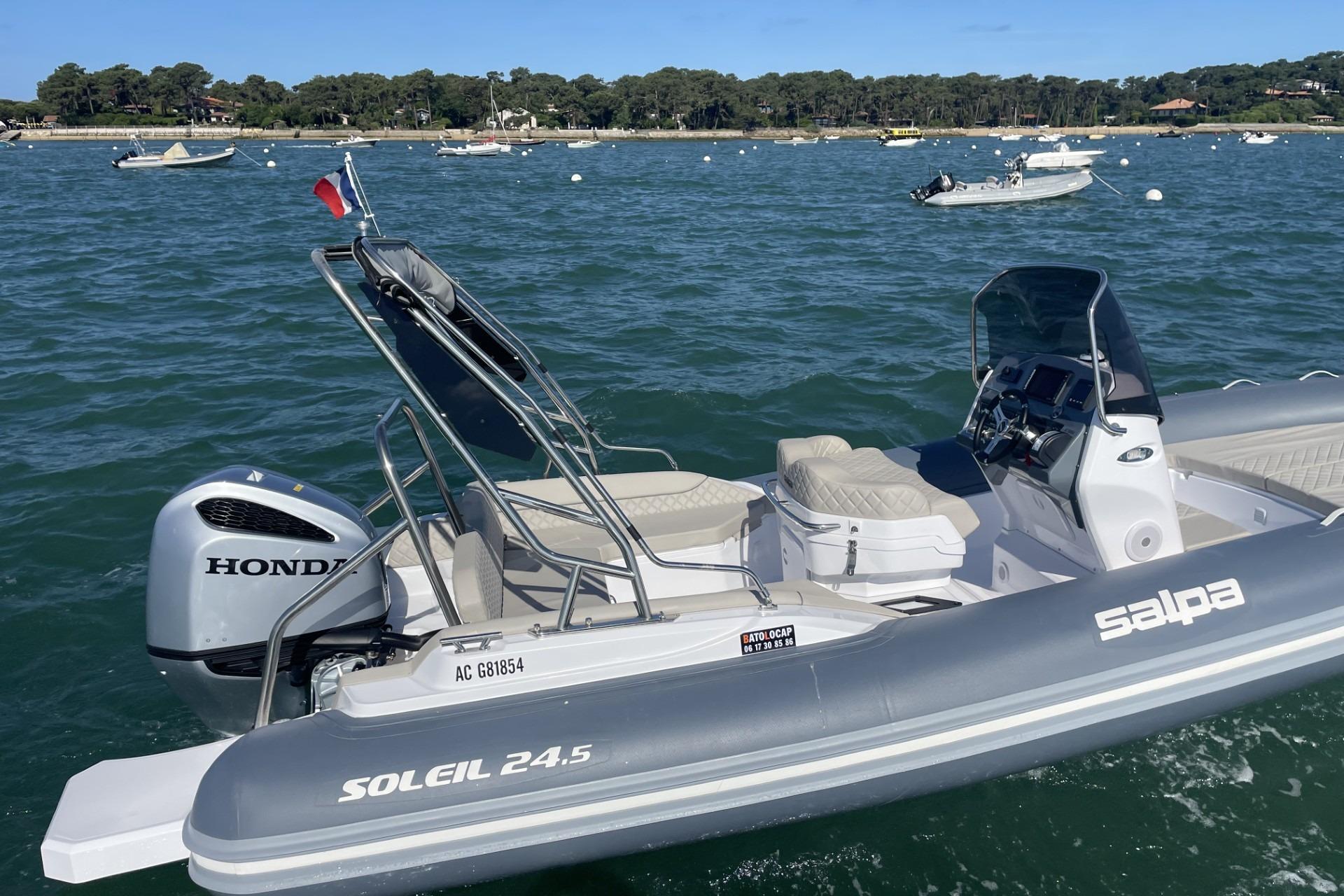 Salpa Soleil 24.5 2025 Salpa Soleil 24.5 boat with Honda engine on a scenic waterway.