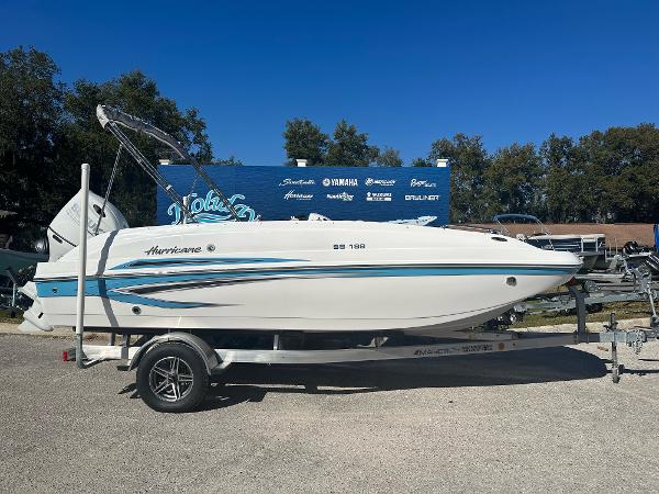 Hurricane SunDeck Sport 188 OB 2024 Hurricane SunDeck Sport 188 OB boat on a trailer, side view.
