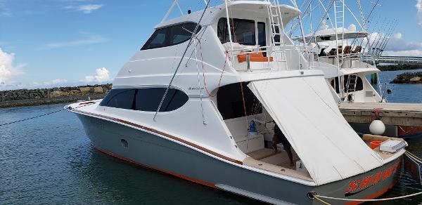 Hatteras 68 Convertible 2007 Hatteras 68 Convertible yacht docked at marina.