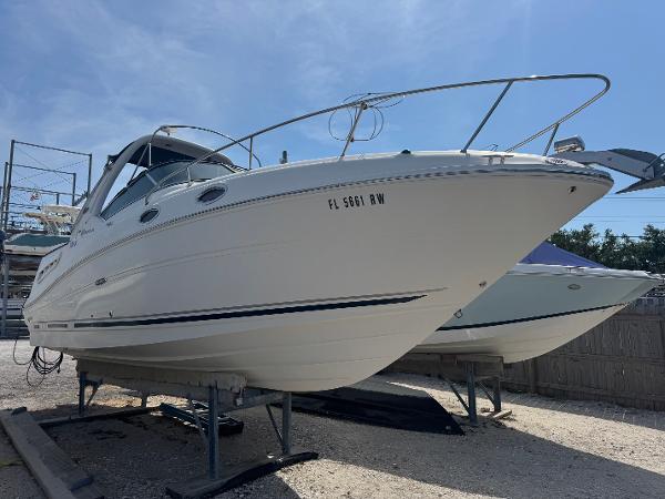 Sea Ray 260 Sundancer 2008 Sea Ray 260 Sundancer boat on dry dock under clear blue sky.