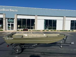 Lowe L1648M Aura Jon 2024 Lowe Jon L1648M Aura boat on trailer outside dealership.