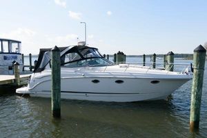 Chaparral Signature 350 Chaparral Signature 350 boat, 2010 model, docked at a marina on a sunny day.