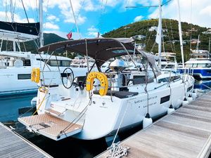 Jeanneau Sun Odyssey 440 2024 Jeanneau Sun Odyssey 440 yacht docked at marina, featuring modern design and spacious deck.