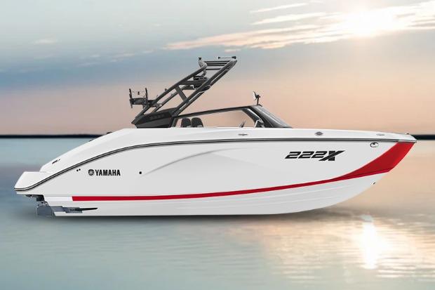 Yamaha Boats 222XD 2026 Yamaha Boats 222XD, sleek white design, red accent, on calm water at sunset.