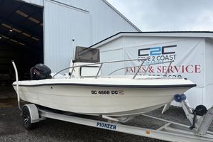 Sea Pro 180 Center Console 1999 Sea Pro 180 Center Console boat on trailer outside marine service building.