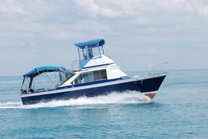 Chris-Craft Sea Skiff 32 Sport Cruiser 1967 Chris-Craft Sea Skiff 32 Sport Cruiser navigating on open water.
