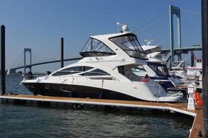 Sea Ray 450 Sedan Bridge 2012 Sea Ray 450 Sedan Bridge yacht docked near a bridge.